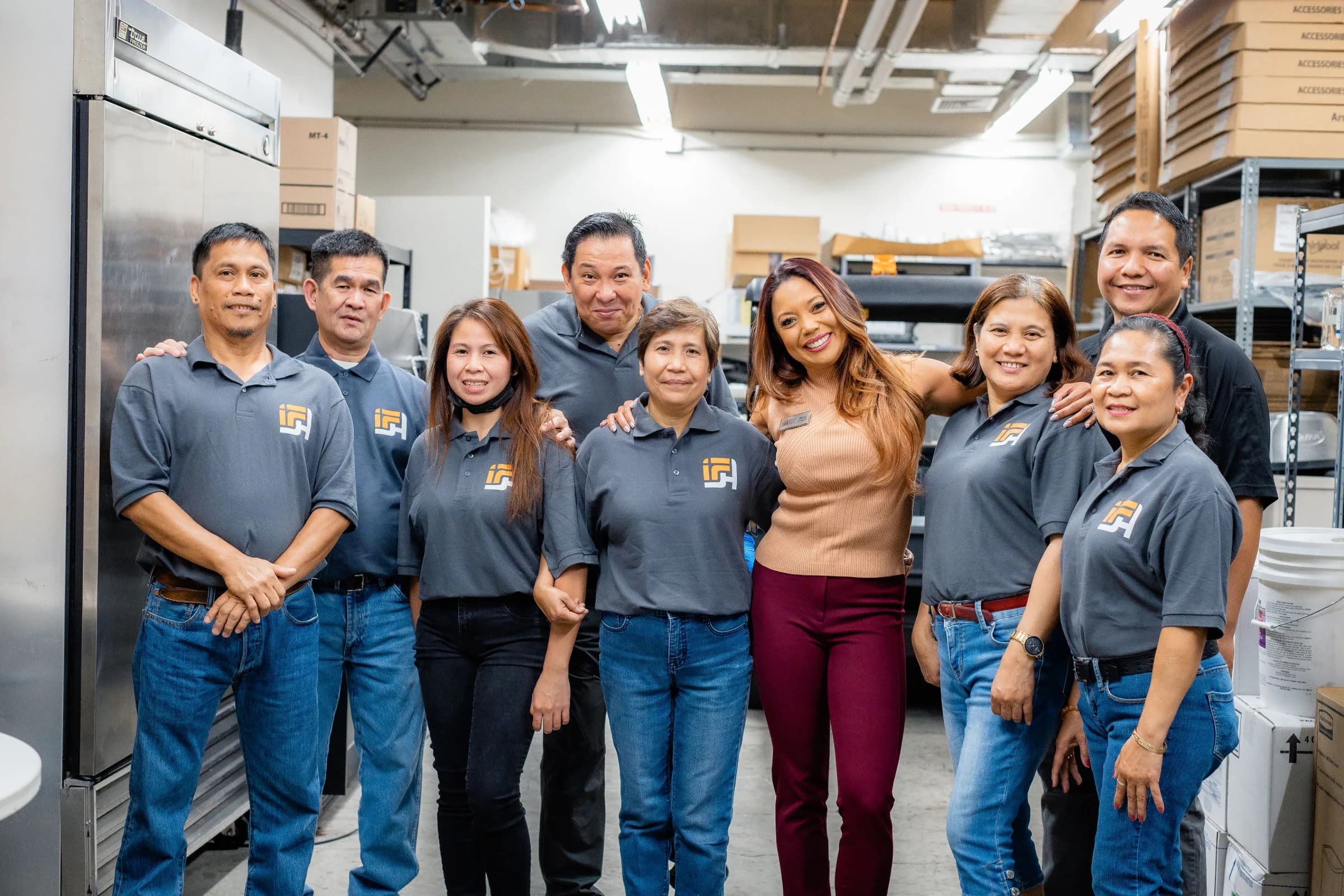 IFSH team members standing together in their operations workspace